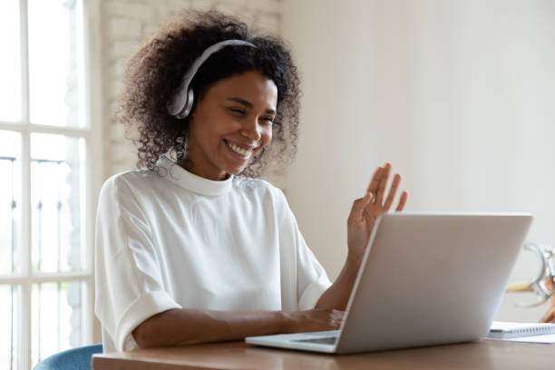 istock African tutor start online lesson with trainee smiling wave hand 1262889273