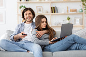 Relaxed married couple spending weekend at home