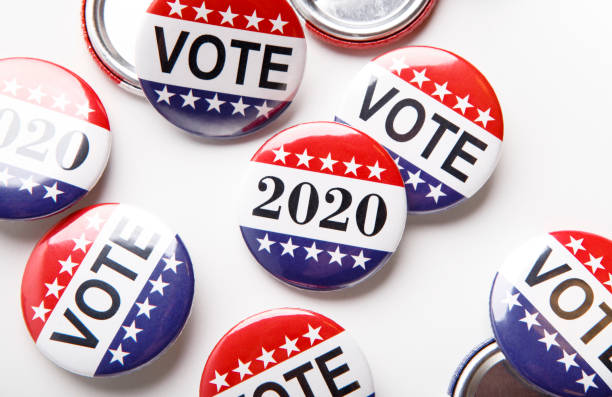 istock Voting poll concept with red, white and blue vote button pins 1262889797