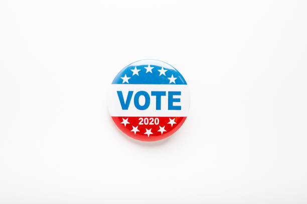 istock Vote button in red, white, and blue colors with stars isolated 1262893089