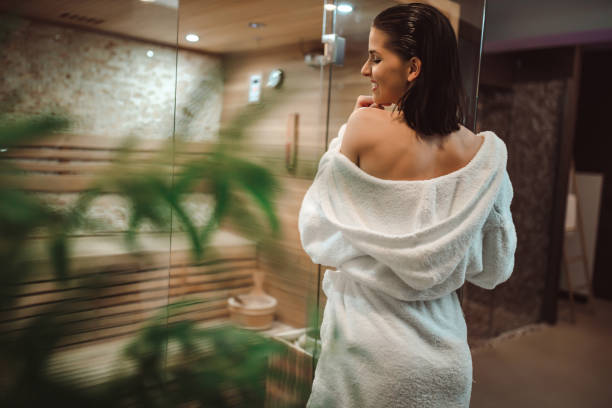 istock Smiling woman enjoying time in the sauna 1262893308
