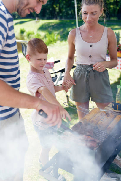 istock Family having a barbecue in the yard 1262893956