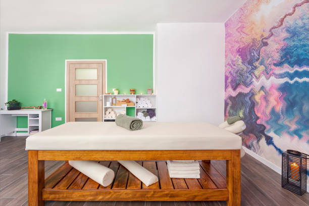 istock Interior of massage room with table bed in spa salon 1262898641