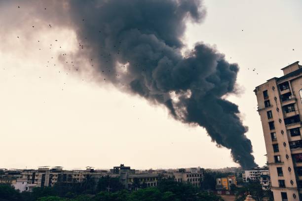 istock Smoke coming out from the fire in factory 1262898954