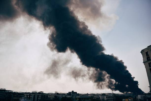 istock Smoke coming out from the fire in factory 1262898974
