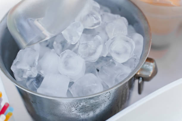 istock Ice bucket on the white table. Ice cubes for cocktail and alcohol drinks. Catering for wedding. 1262901785