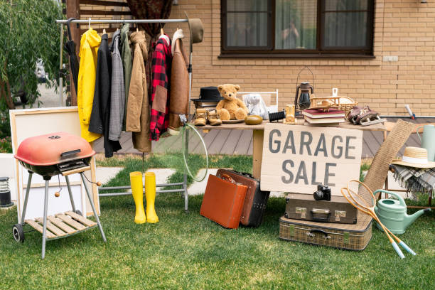 Nobody at garage sale Clothes rack, old-fashioned suitcases, garden tools and interior goods selling at garage market in backyard second hand stock pictures, royalty-free photos & images