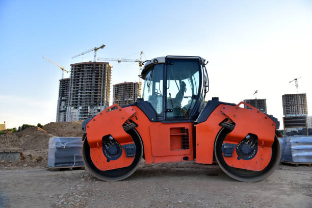 istock Paving roller machine during road work. Road roller at construction site for paving works 1262905578