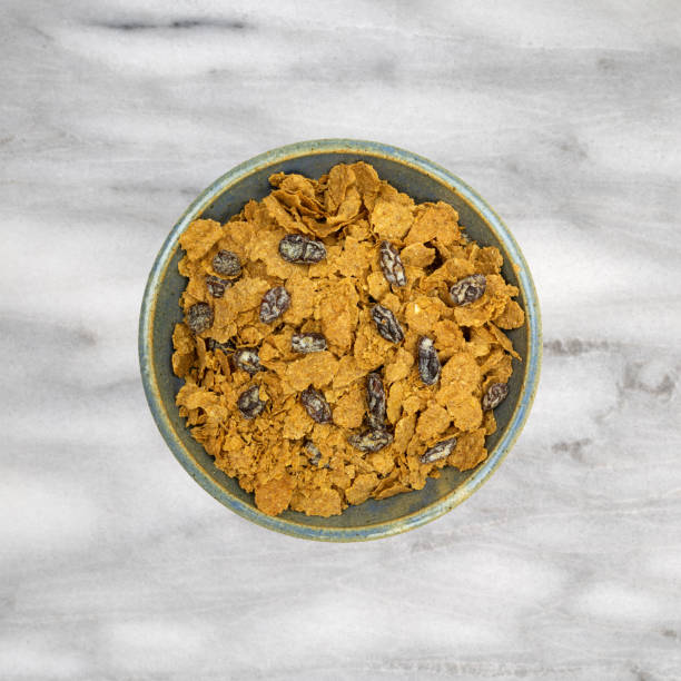 istock Bran flake cereal with raisins in a stoneware bowl 1262908801