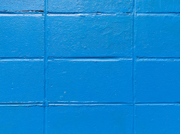 istock Close view of rows of old concrete blocks painted blue 1262908932