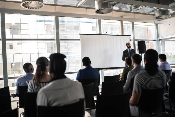 istock Business people attending a seminar with social distancing 1262909617
