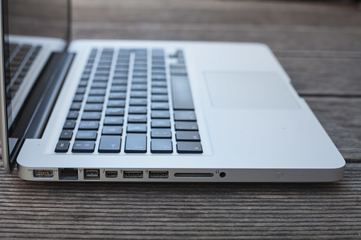 Laptop ports on wooden desk