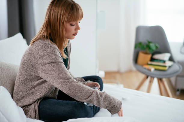 istock Young sick woman taking medicine pill. 1262909733