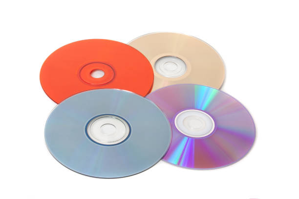 several multi-colored cd on a white background - blu ray disc imagens e fotografias de stock
