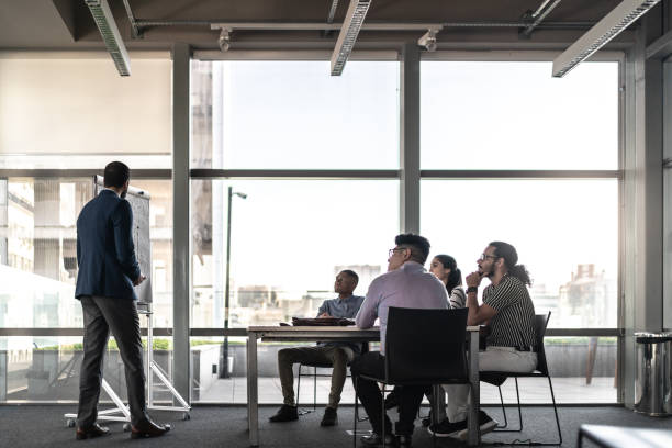 istock Manager doing a business meeting with his colleagues 1262911421