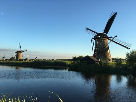 Dutch Holland windmill field canal sunset, Netherlands Holland