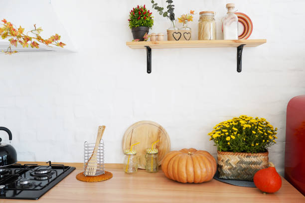 istock Autumn kitchen decoration with pumpkins, turquoise loft style kitchen decorated for Halloween or Thanksgiving 1262913076