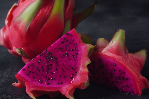 Dragon fruit (Pitaya, Pitahaya) Cut into half, one whole, two sliced pieces pitahaya fruit. Dragon fruit (Pitaya, Pitahaya) Cut into half, one whole, two sliced pieces
pitahaya fruit. dragon fruit flower stock pictures, royalty-free photos & images