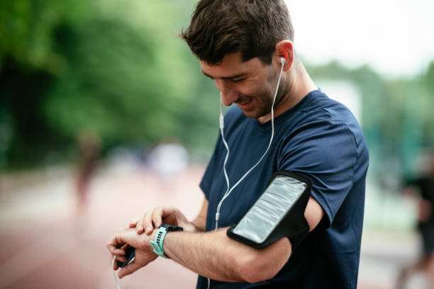 istock Young man checking his heart rate during work out. 1262915060