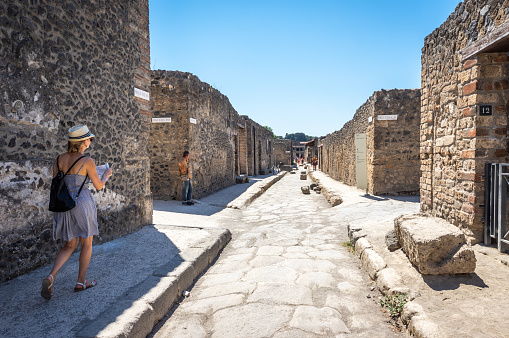 Pompeii, Italy - August 6, 2017: tourist walking in the ruins of pompeii