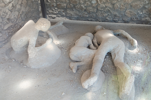 Gypsum cast of people in their last moments of life in ancient city of Pompeii, Italy