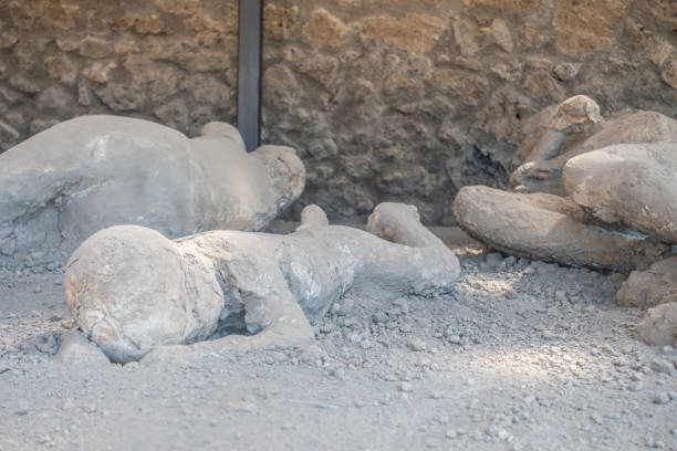 Gypsum cast of people in their last moments of life in ancient city of Pompeii, Italy Gypsum cast of people in their last moments of life in ancient city of Pompeii, Italy victims the ruins of pompeii stock pictures, royalty-free photos & images