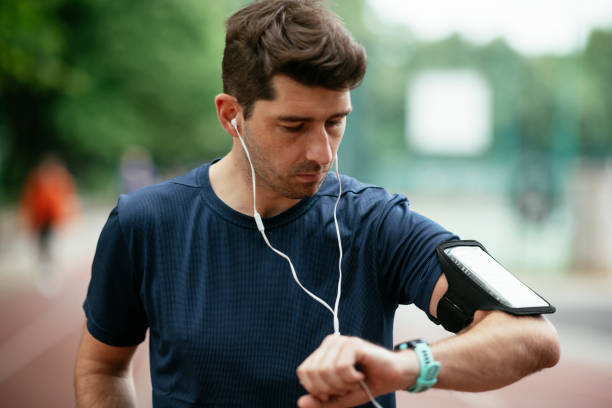 istock Young man checking his heart rate during work out. 1262915509