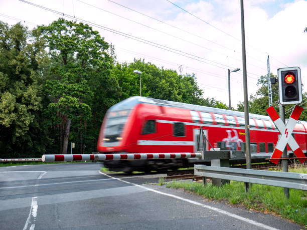 istock train in motion at the level crossing 1262918570