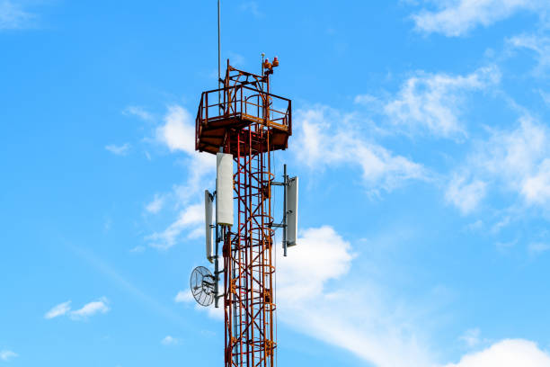 istock Telecommunications antennas on a red and white telecommunications tower with clear blue sky in the background 1262924606