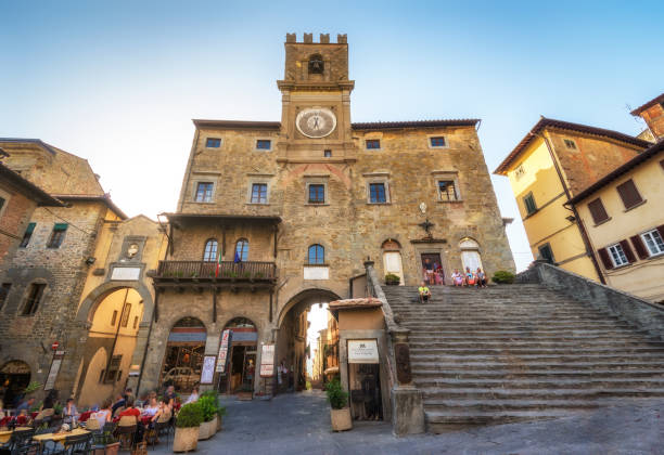 town hall in Cortona, Tuscan , Italy Cortona, Italy - August 9, 2017: tourists in front of The town hall in Cortona, Tuscan , Italy cortona stock pictures, royalty-free photos & images