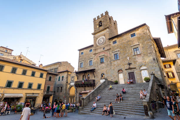 The town hall in Cortona, Tuscan , Italy Cortona, Italy - August 9, 2017: tourists in front of The town hall in Cortona, Tuscan , Italy cortona stock pictures, royalty-free photos & images