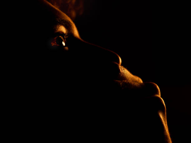 istock Man dark hand mouth horror 1262943938