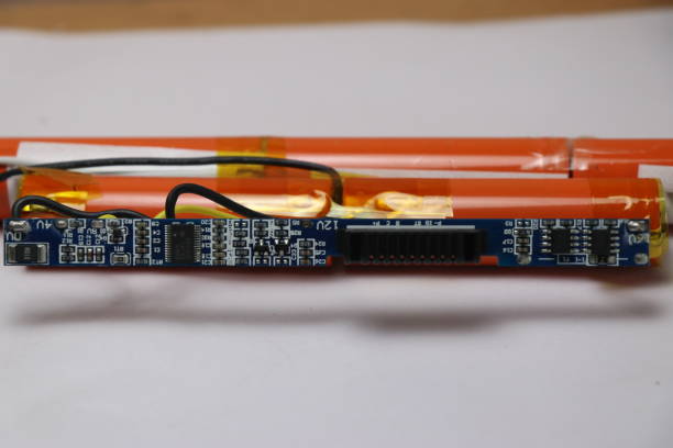 istock Disassembled view of laptop battery with electronic circuit board 1262947361