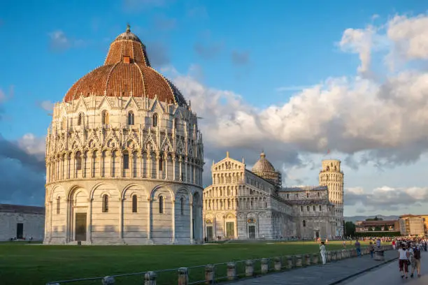 Photo of San Giovanni Baptistery, Pisa Cathedral and Leaning Tower of Pisa at sunrise. Pisa ,Tuscany region, Italy