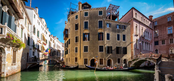 Venice, Italy – August 13, 2017: Gondola Sailing in the Venetian Canals with tourist