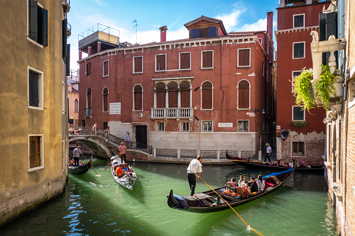 Young adult asian couple exploring Venice, Italy