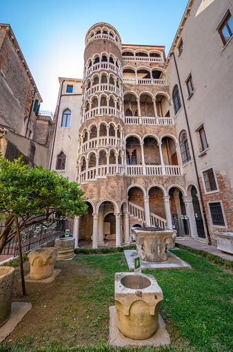 Venice, Italy, August 15, 2017: Scala Contarini del Bovolo of Contarini Palace, ancient spiral staircase, in downtown. UNESCO world heritage site. Veneto, Italy, Europe