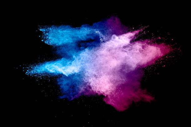 istock Abstract blue pink powder explosion on white background. Closeup of blue pink dust particles splash isolated. 1262959092