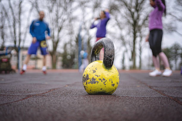 Kettle bell placed on the floor of an outdoor gym