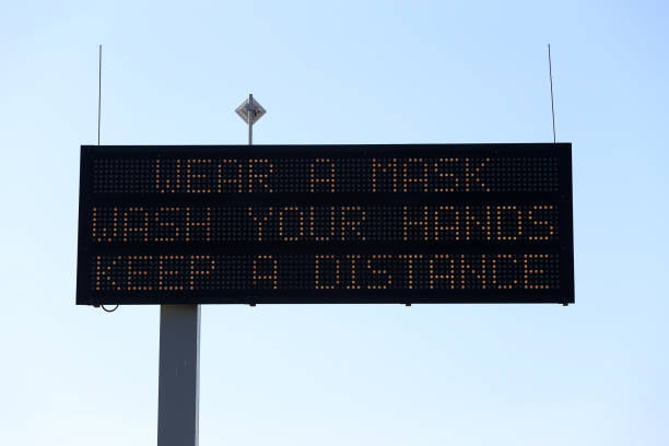 istock A Covid-19 Prevention message on a Electronic road sign 1262961601
