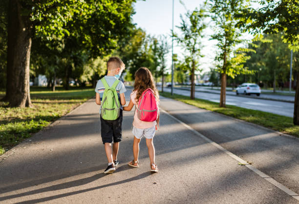istock Two school children going back to school 1262962982