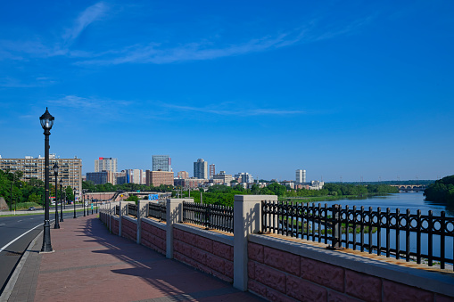 New Brunswick, New Jersey USA, July 19, 2020 - A view of the skyline of New Brunswick, New Jersey and the Raritan River.  The city is also the  home of Rutgers University.