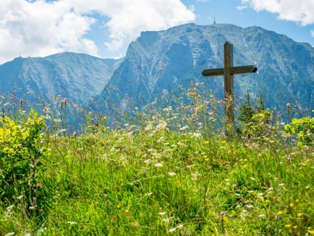istock A cross with Bucegi Mountains in the background. Beutiful landscape with Carpathian Mountains in Romania. 1262968043