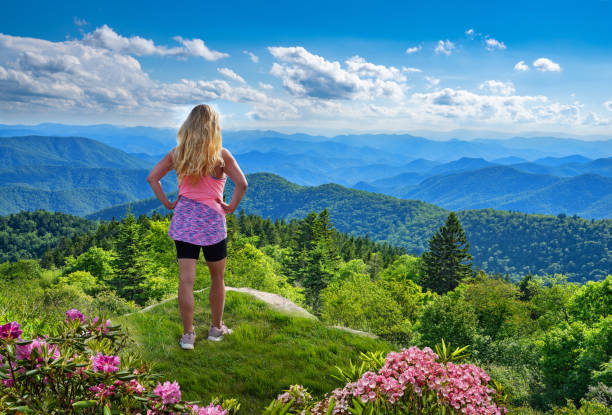 istock Girl hiker enjoying beautiful mountain view. 1262971641