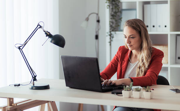 istock Young beautiful businesswoman working on her laptop computer 1262973380