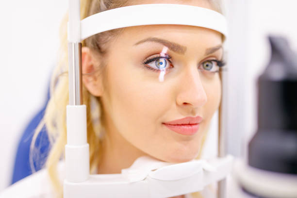 istock Beautiful young woman on eyesight check-up 1262979531