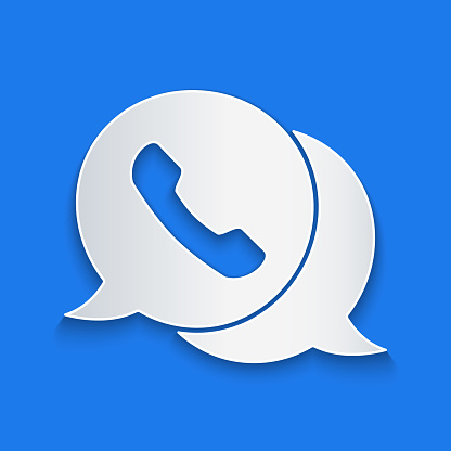 Paper cut Telephone with speech bubble chat icon isolated on blue background. Support customer service, hotline, call center, faq. Paper art style. Vector Illustration