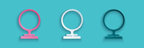 istock Paper cut Round makeup mirror icon isolated on blue background. Paper art style. Vector Illustration 1262984549