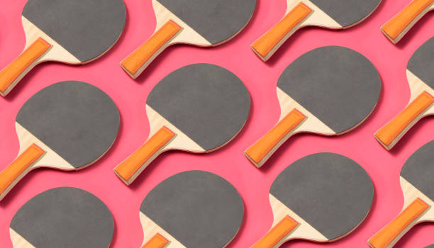 istock Black Ping Pong Paddle on Pink Background 1262987161
