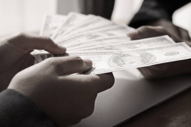 istock businessman's hand has dollar dollar. 1262989299